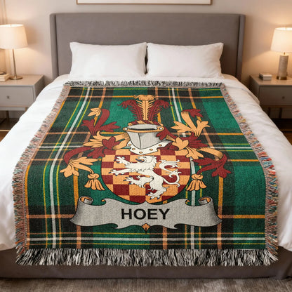 Plaid blanket with a lion crest and "HOEY" banner.