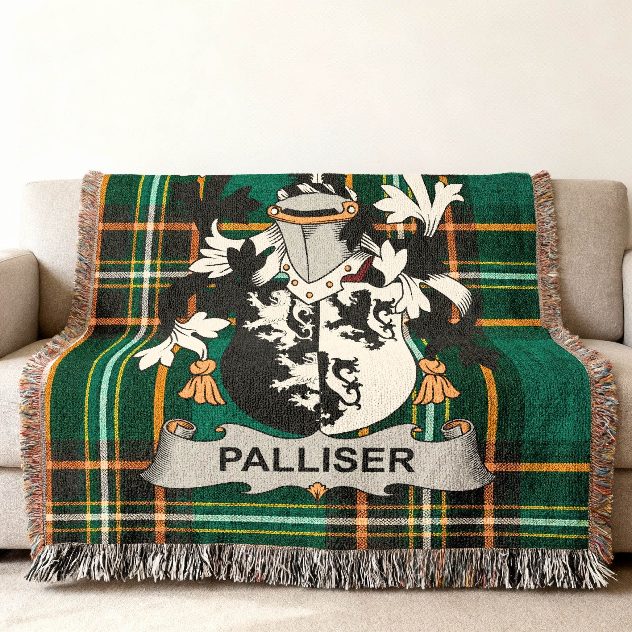 Woven throw blanket with green plaid and a Palliser family crest.