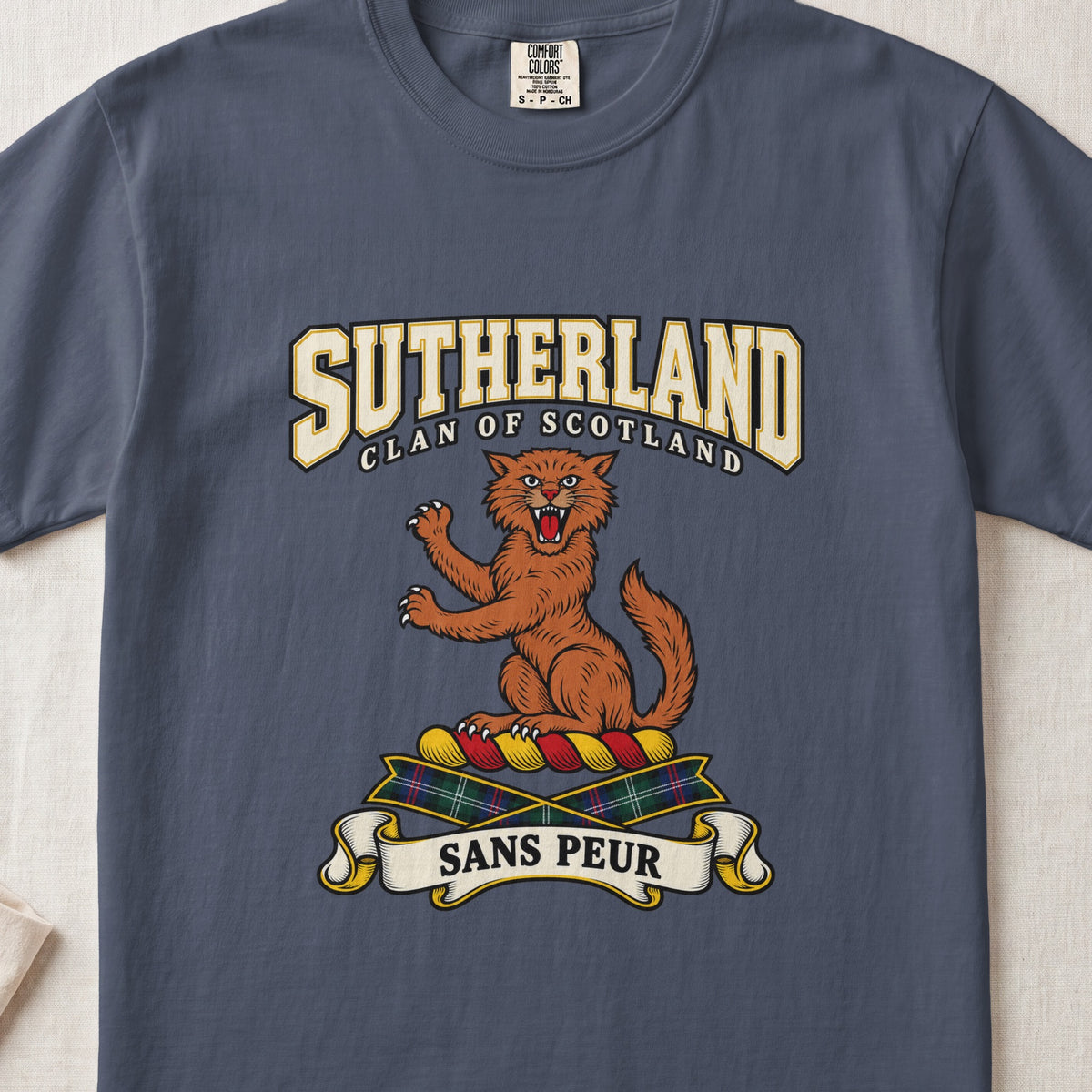 Sutherland graphic T-shirt in Midnight blue, front flat lay showing varsity lettering and orange-brown wildcat with raised paws and open mouth.