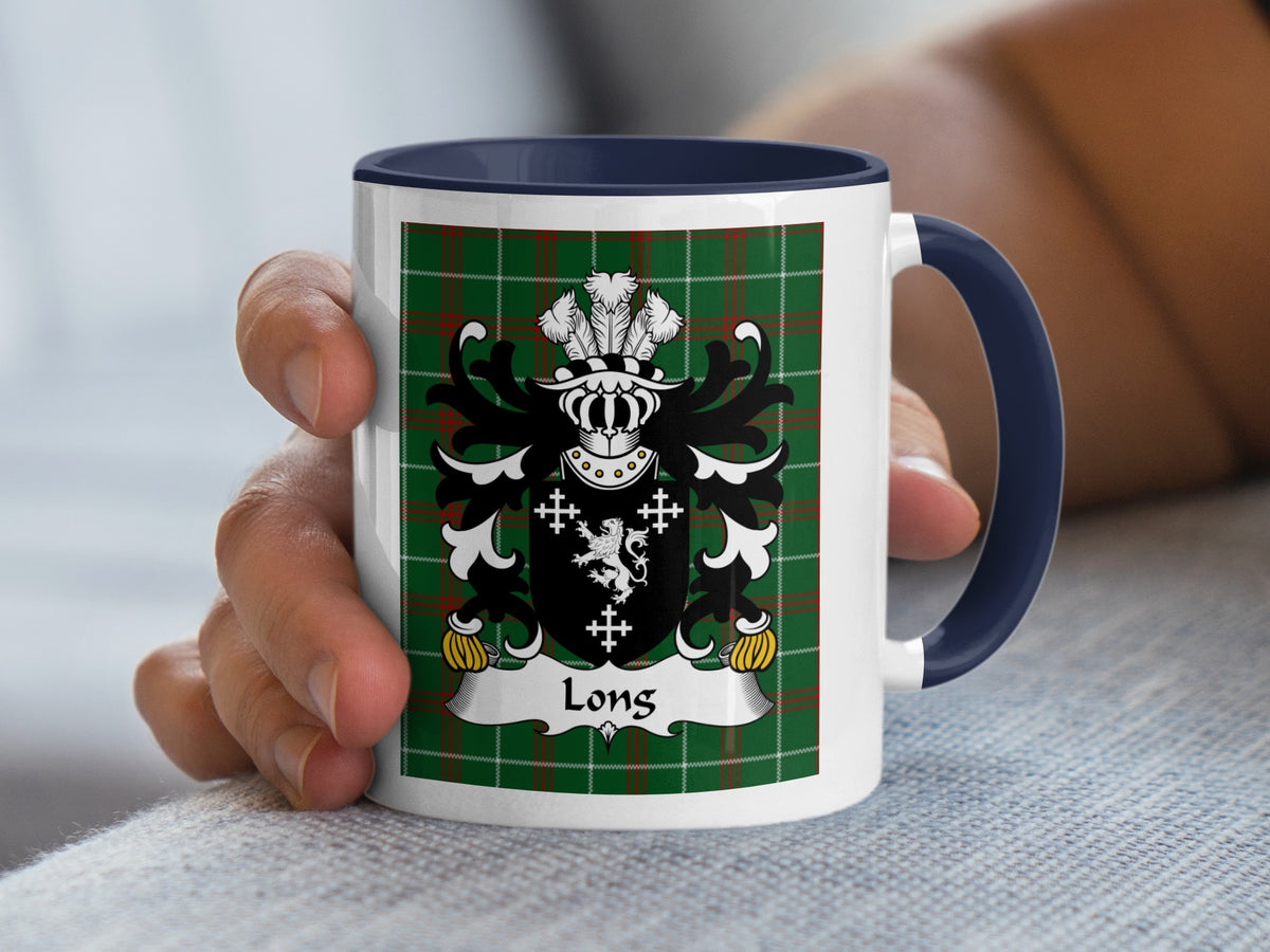 White mug with navy handle featuring a Welsh family crest design on a tartan background.