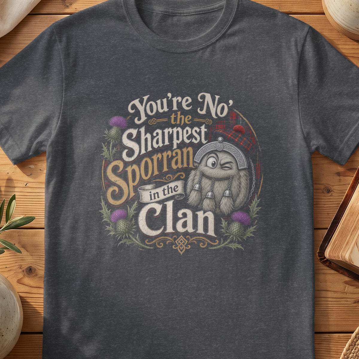 Dark grey Gildan 64000 unisex T-shirt flatlay with Sharpest Sporran in the Clan Scottish graphic design