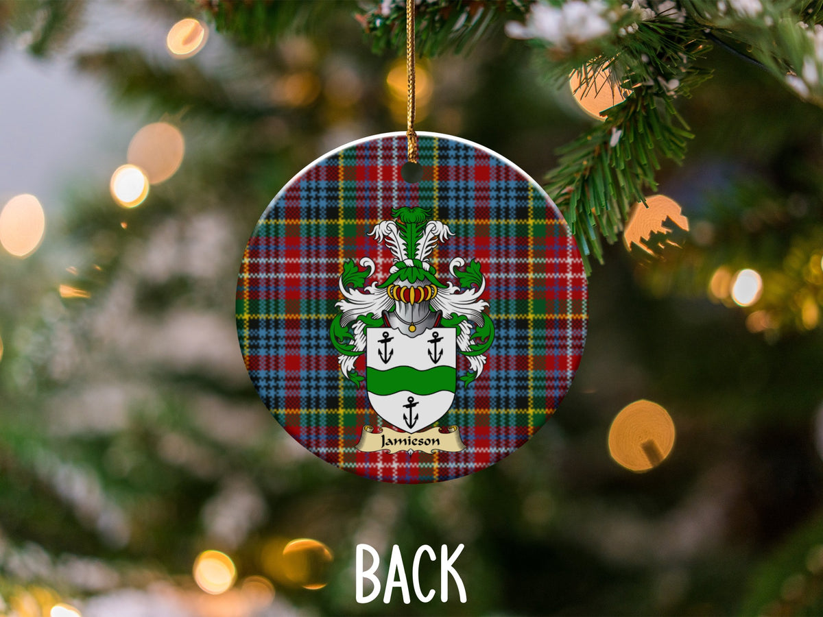 Jamieson ceramic ornament detail showing a double-sided family shield on a Caledonia tartan background