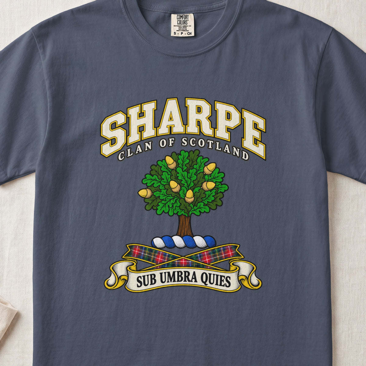 Sharpe Scottish clan T-shirt in Midnight, front view with a green tree with golden acorns and motto design.