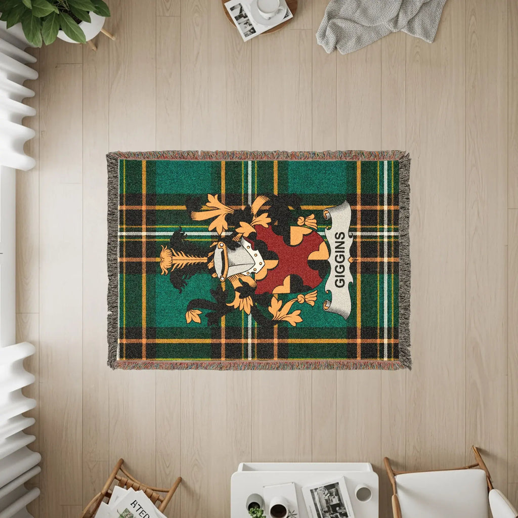 Tartan woven blanket with a family crest and the name GIGGINS.