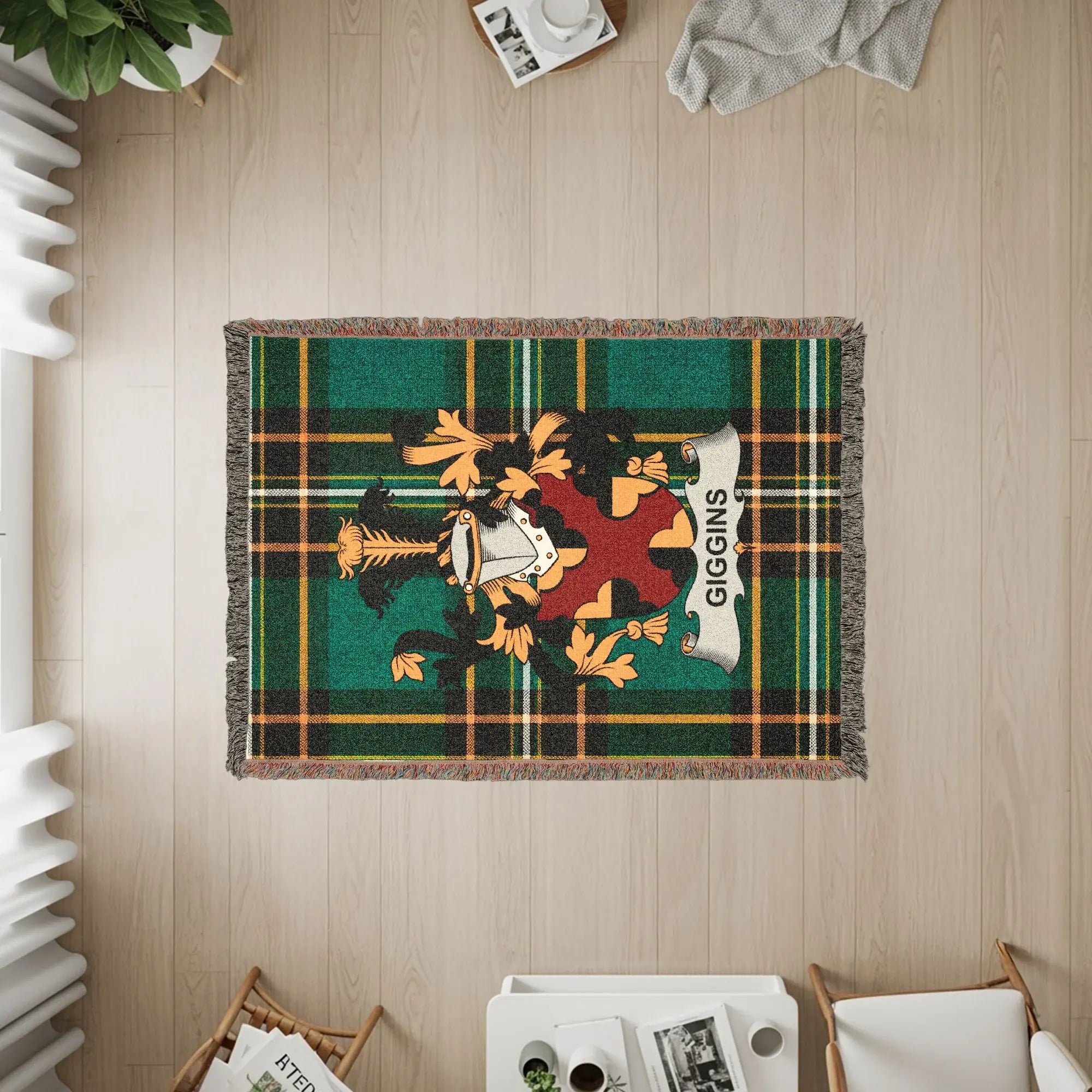 Tartan woven blanket with a family crest and the name GIGGINS.
