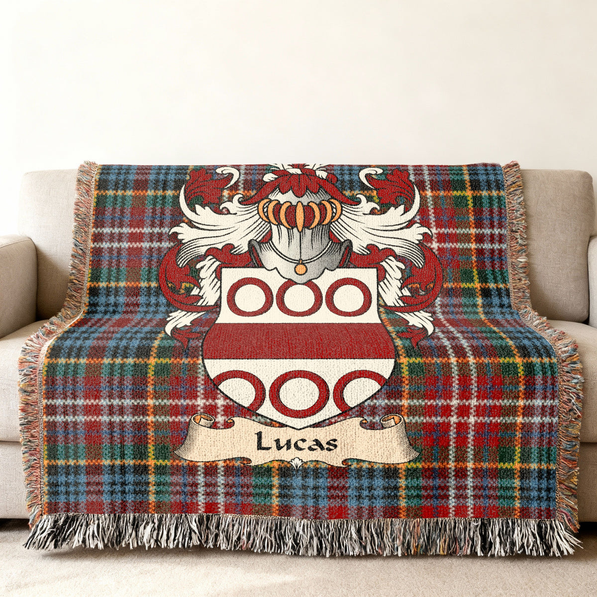 Lucas family crest emblem on a Caledonia tartan woven blanket