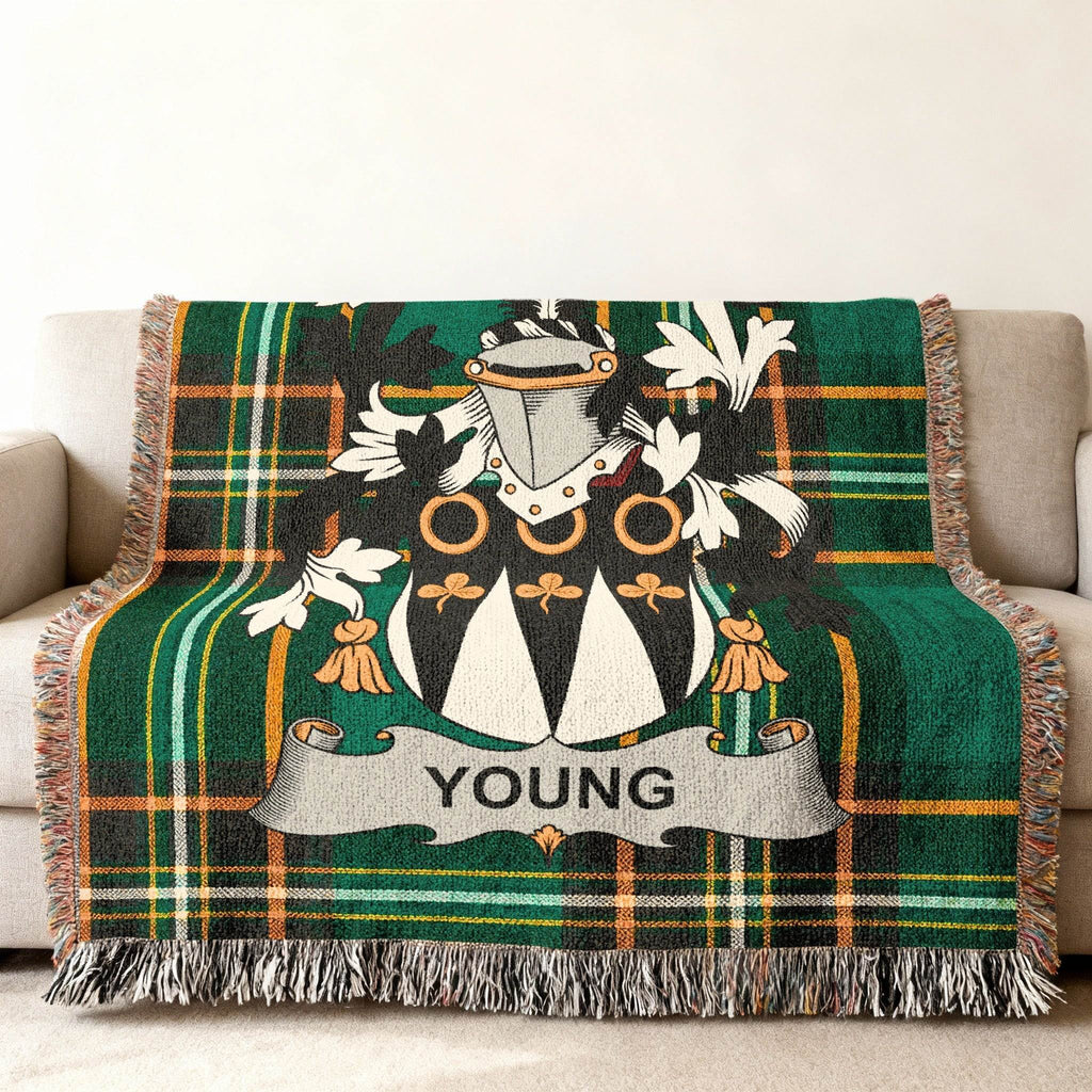 Green plaid woven blanket with the YOUNG family crest.