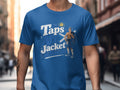 Blue t-shirt graphic with text "Taps Aff Jacket" and a shirtless man in a kilt.