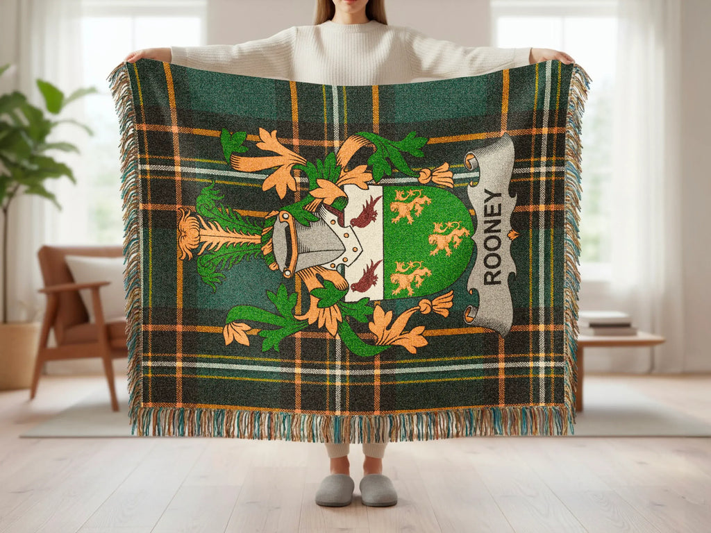 Green tartan blanket with Rooney family crest displayed.