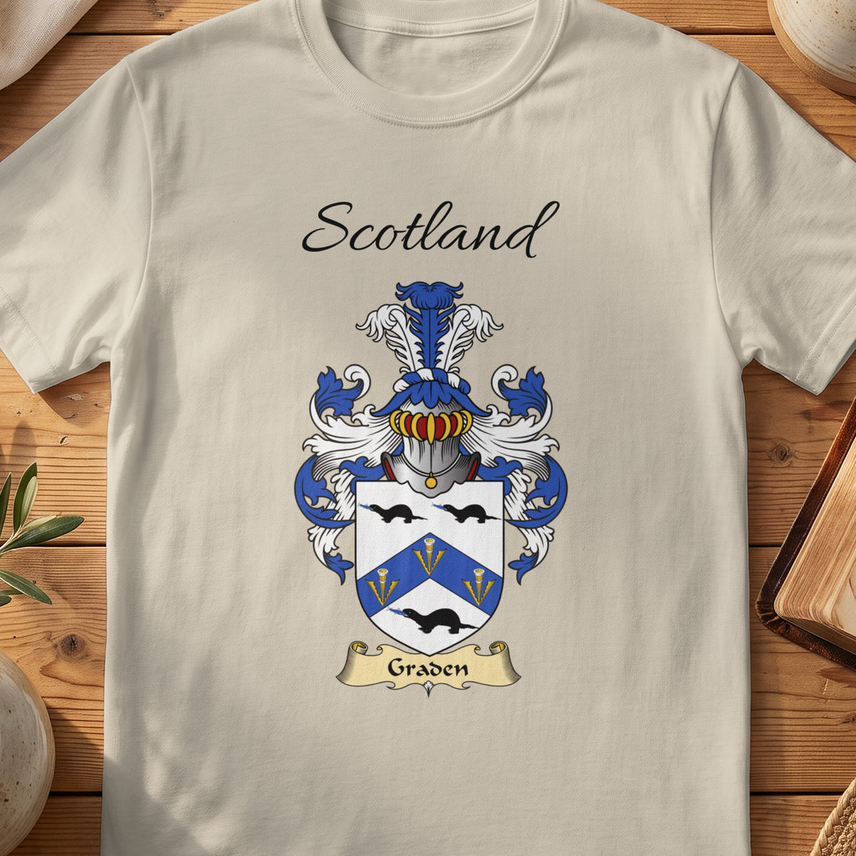 Sand Graden Scottish family shield T-shirt featuring a blue chevron between black birds