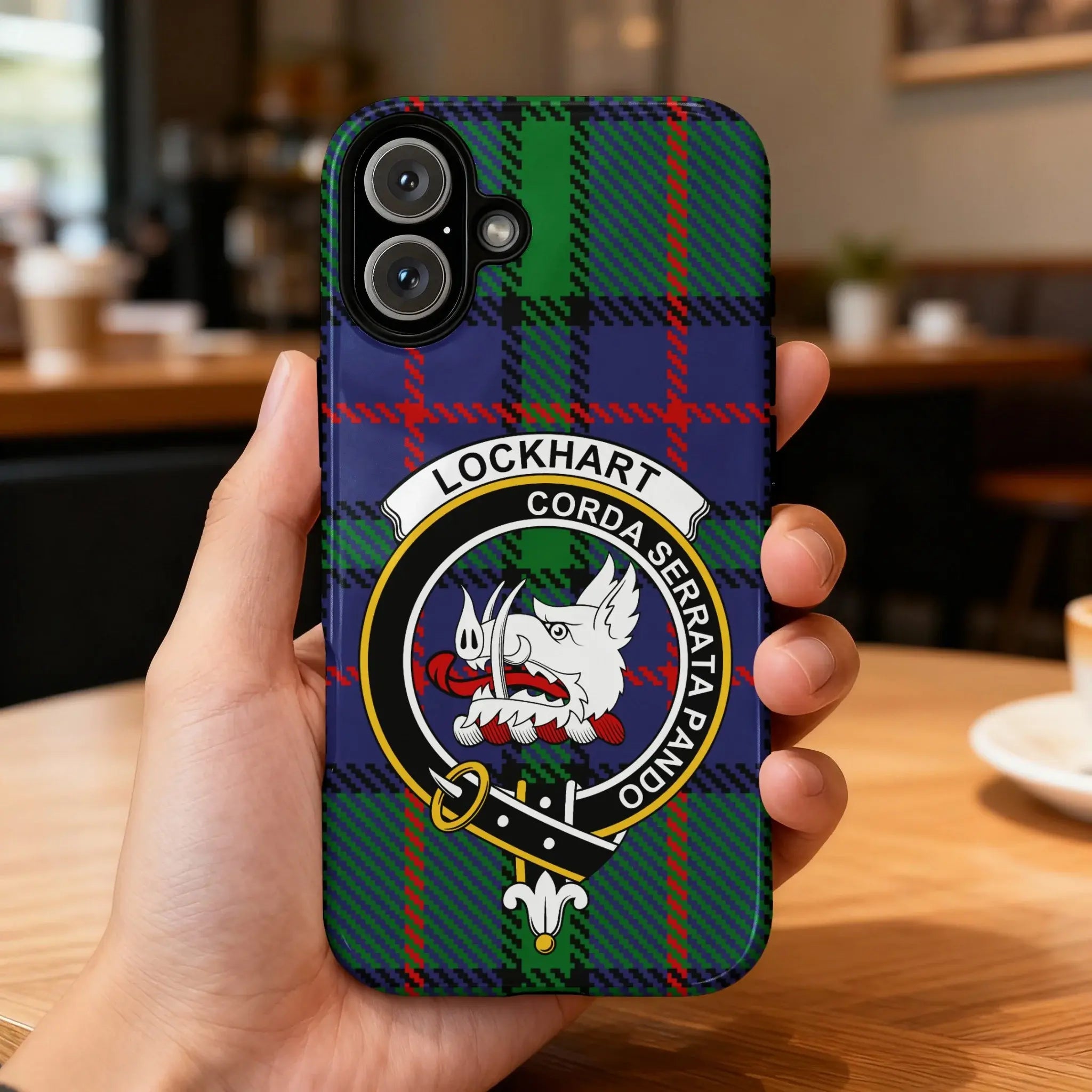 Clan Lockhart crest phone case — iPhone fit shown, edge-to-edge tartan print with precise port cutouts