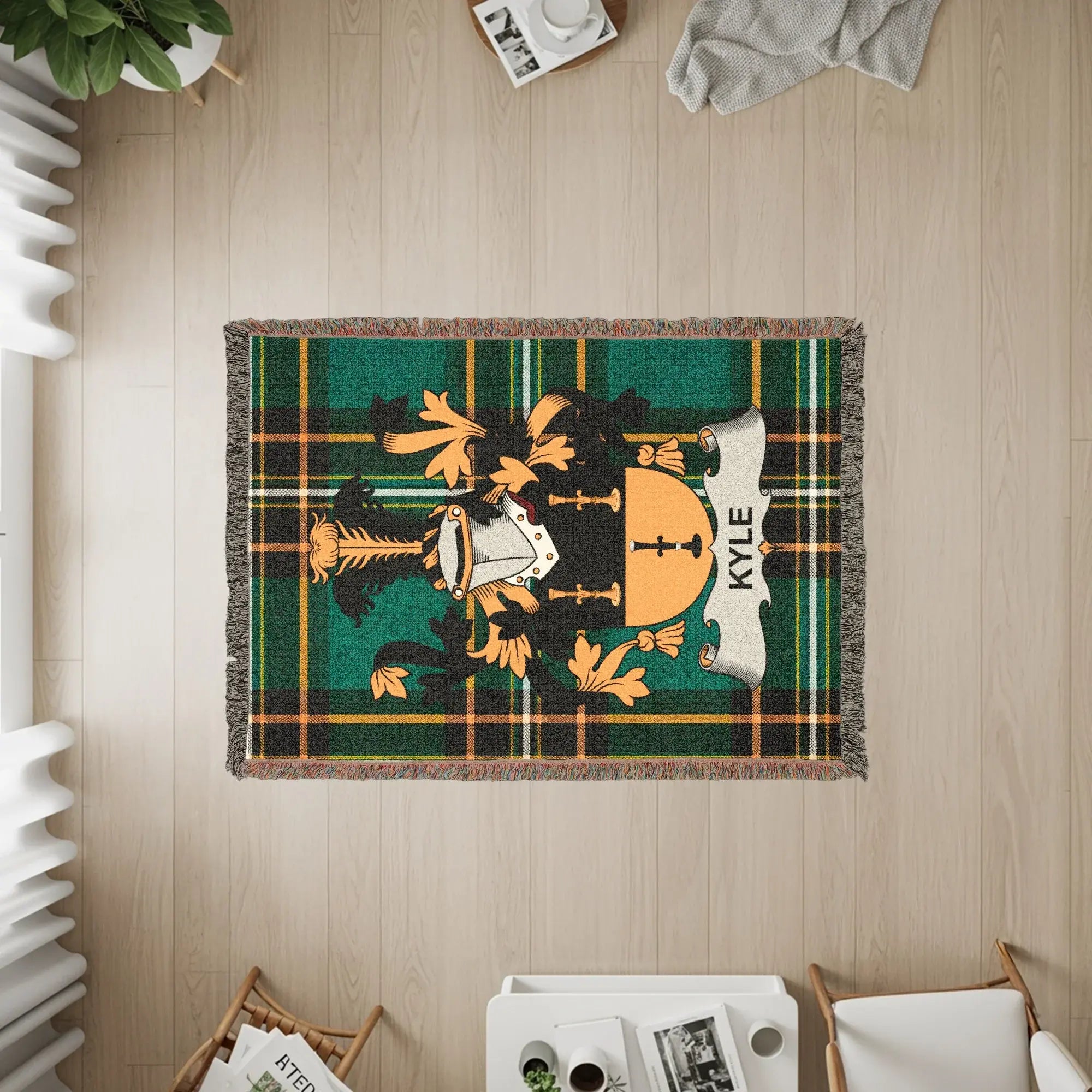 Woven blanket featuring the Kyle family crest on a plaid background.