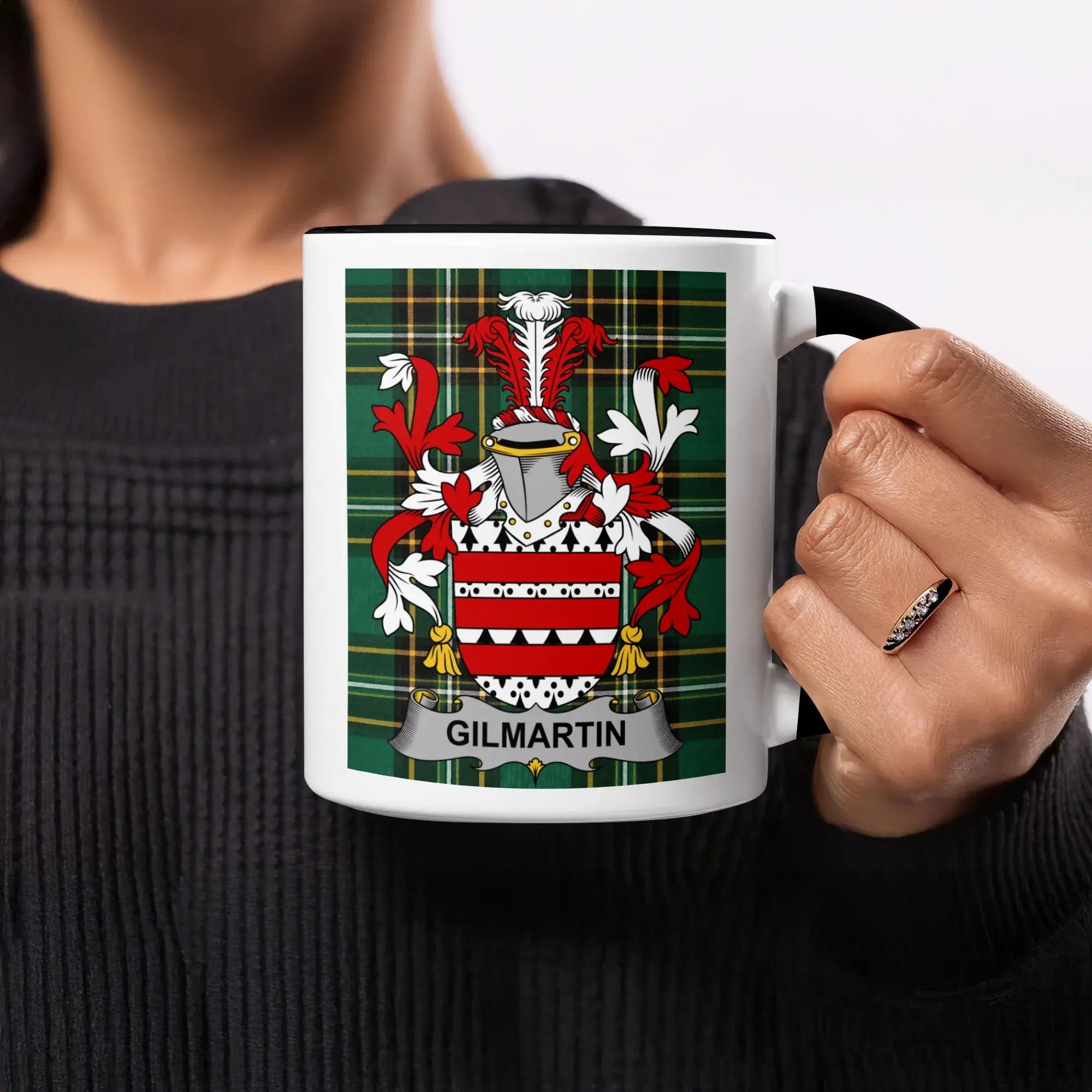 Gilmartin family crest on a white mug with a black rim and handle.