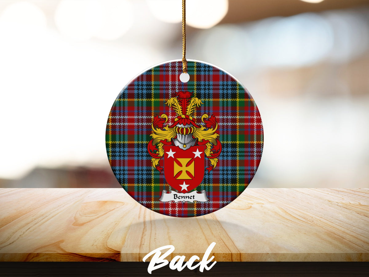 Round Bennet Scottish clan ornament with family crest on a Caledonia tartan background