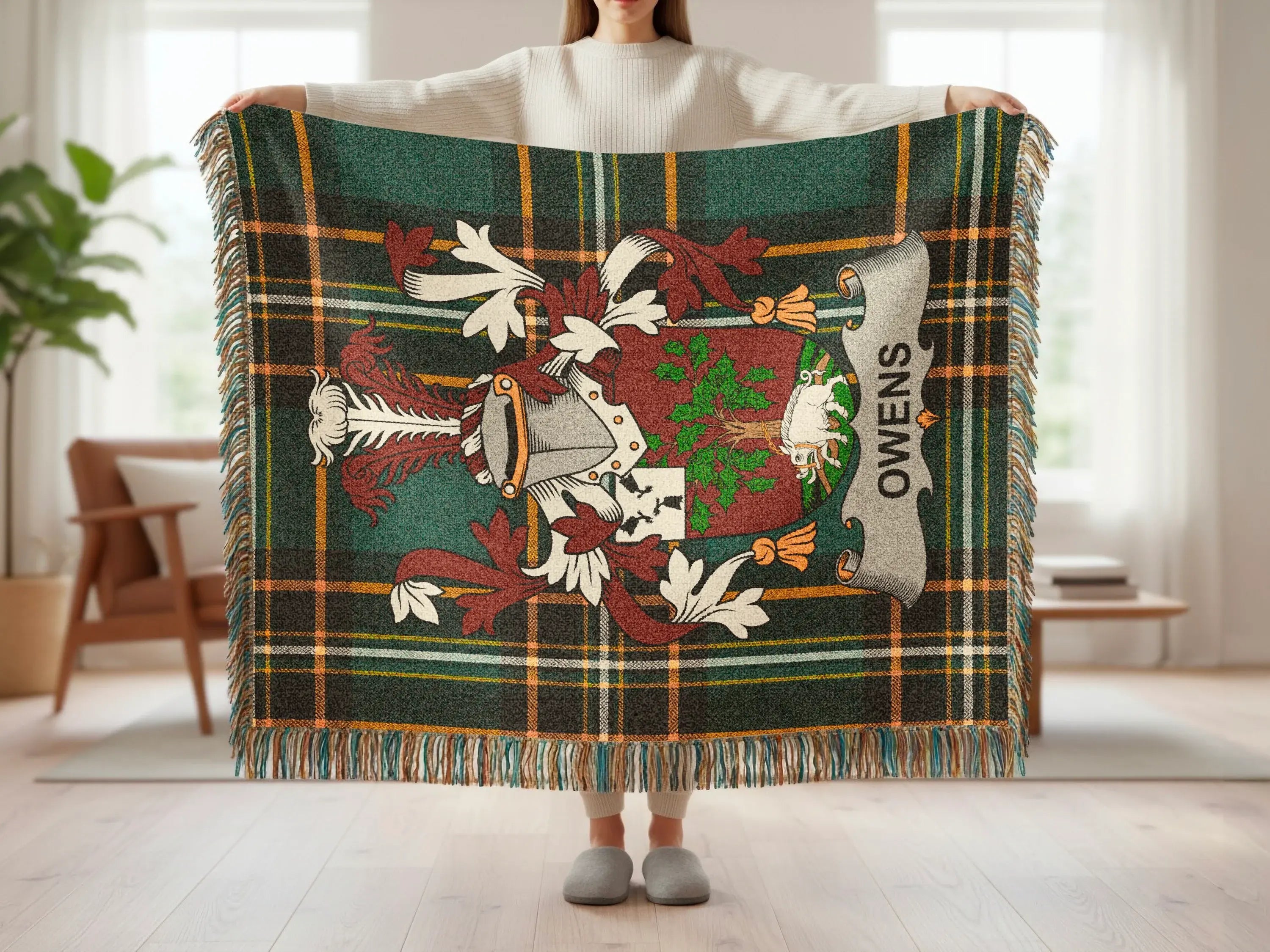 Green plaid throw blanket with family crest and "OWENS" text.