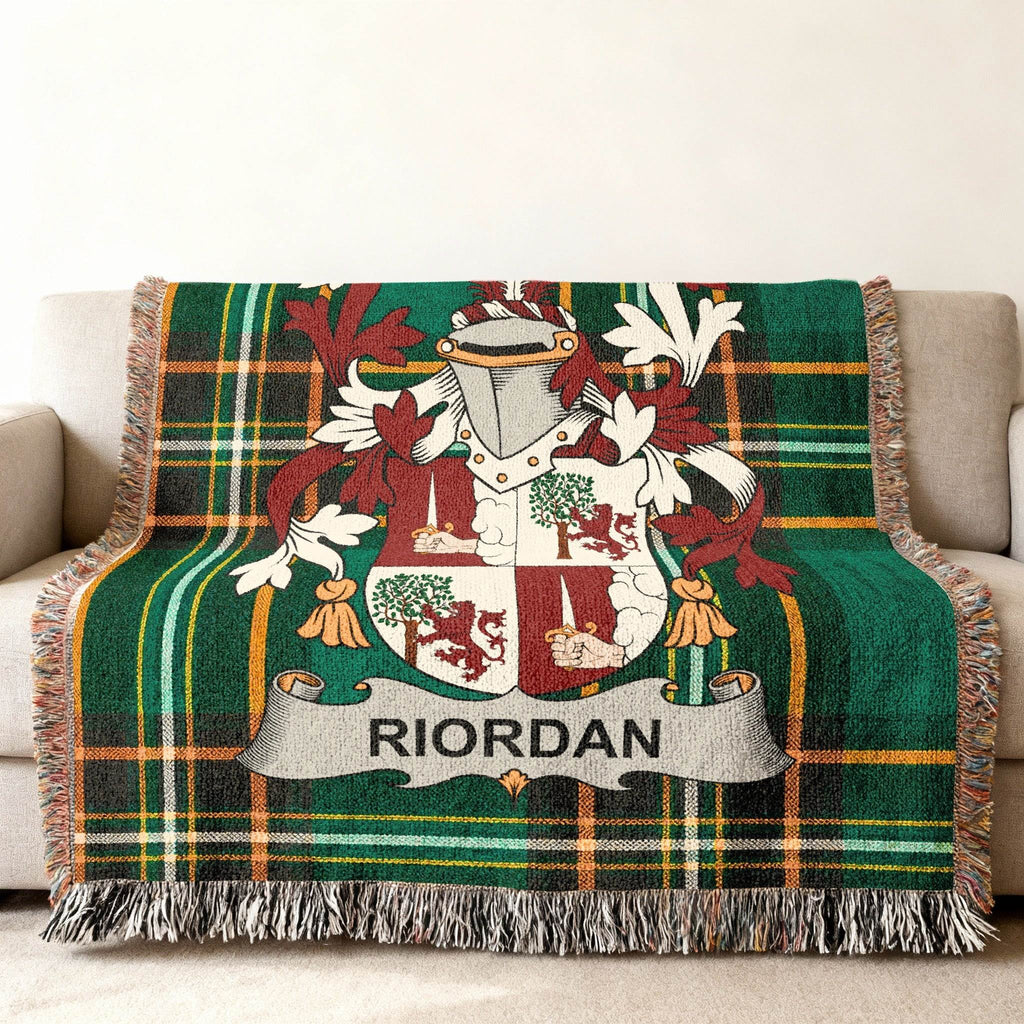 Green tartan throw blanket featuring the Riordan family crest.