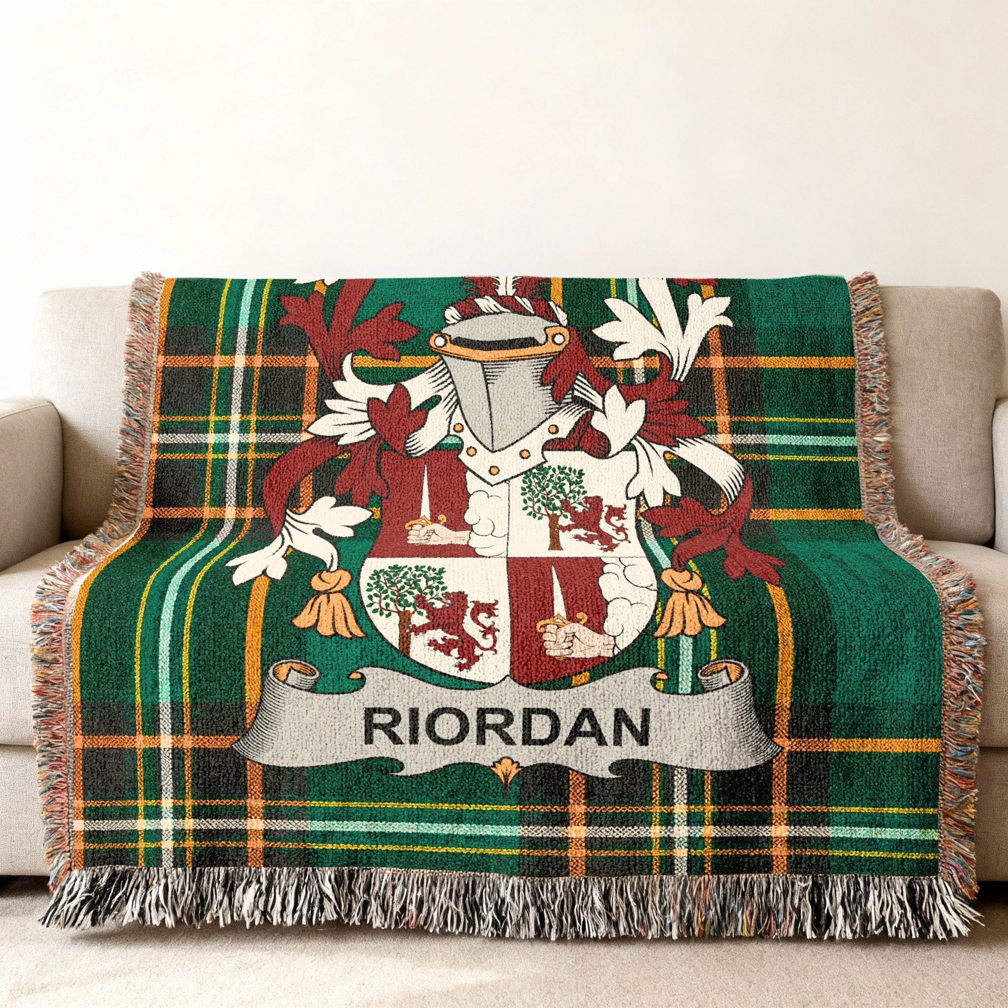 Green tartan throw blanket featuring the Riordan family crest.