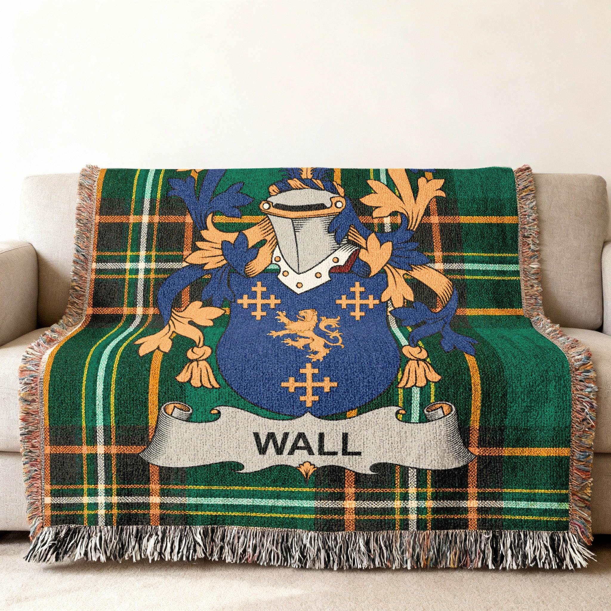 Green tartan blanket with Wall family crest displayed in the center.