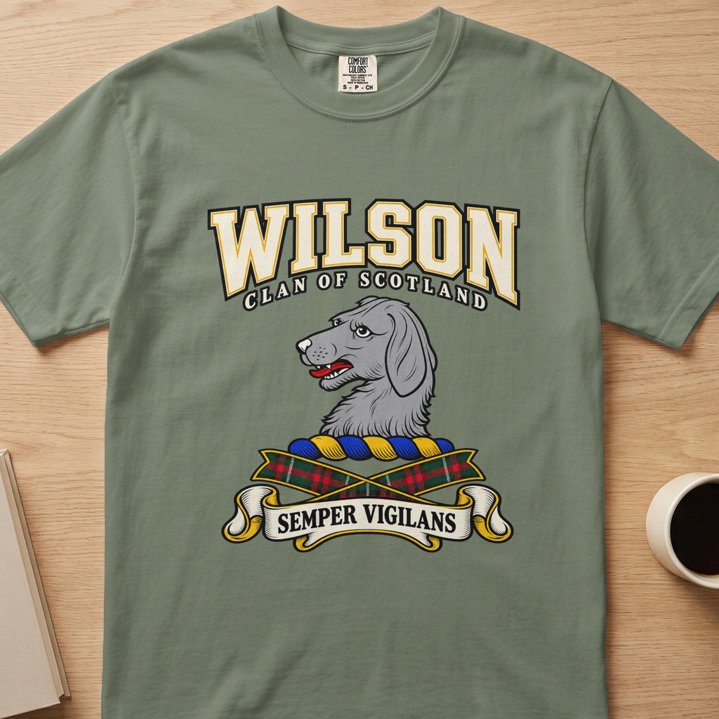 Wilson gray dog’s-head crest graphic on a sage green Comfort Colors T-shirt, front view