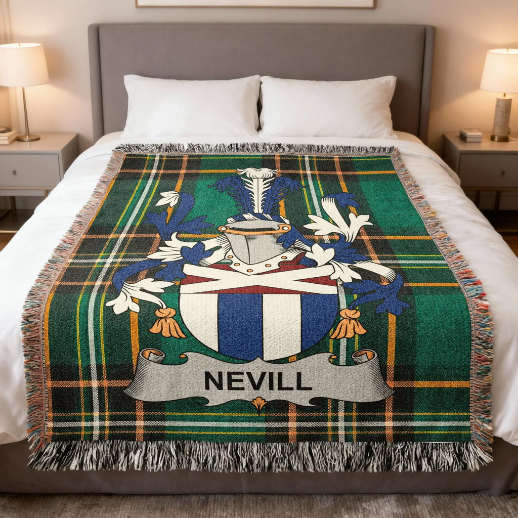 Green tartan blanket with Nevill family crest displayed on a bed.