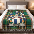 Green tartan blanket with Nevill family crest displayed on a bed.