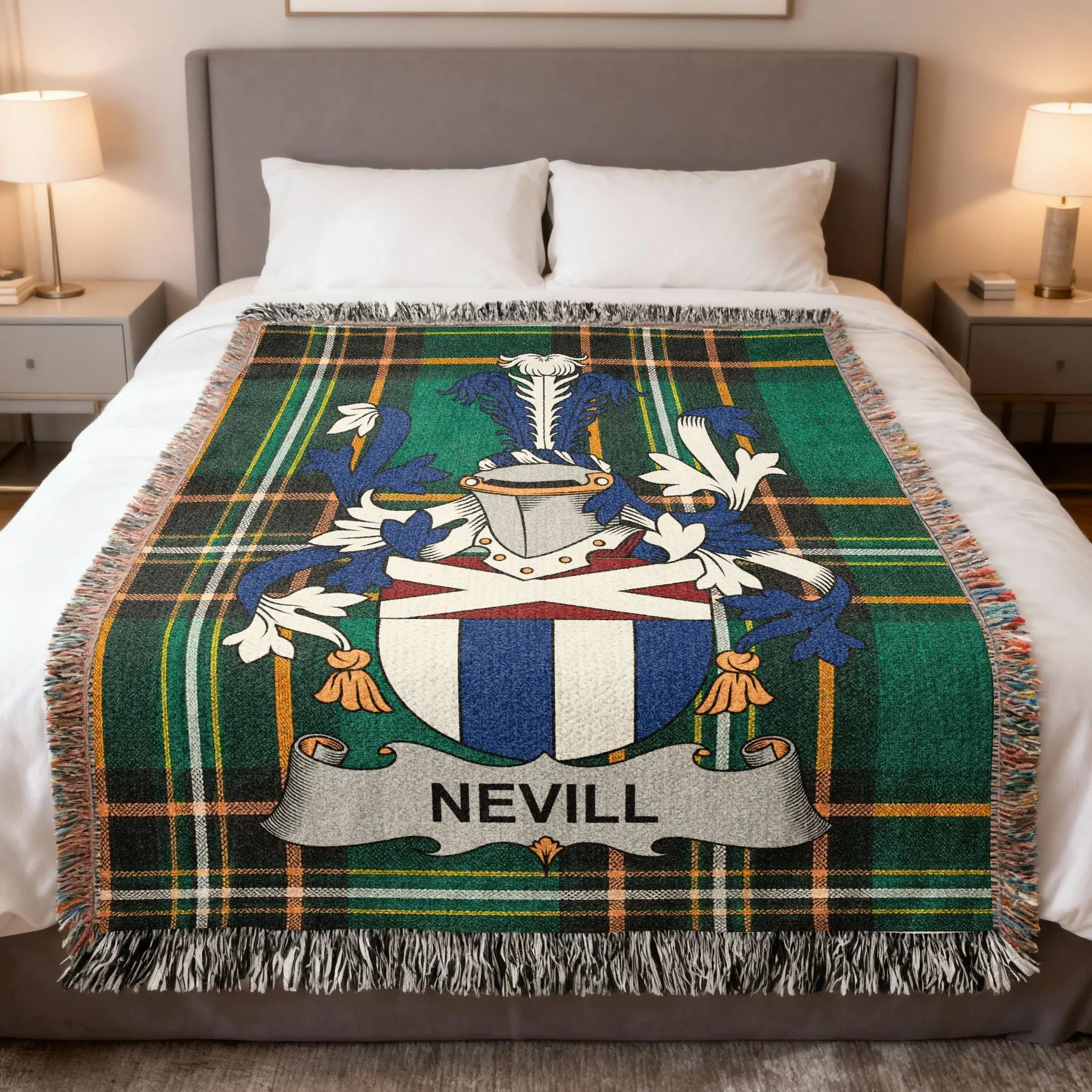Green tartan blanket with Nevill family crest displayed on a bed.