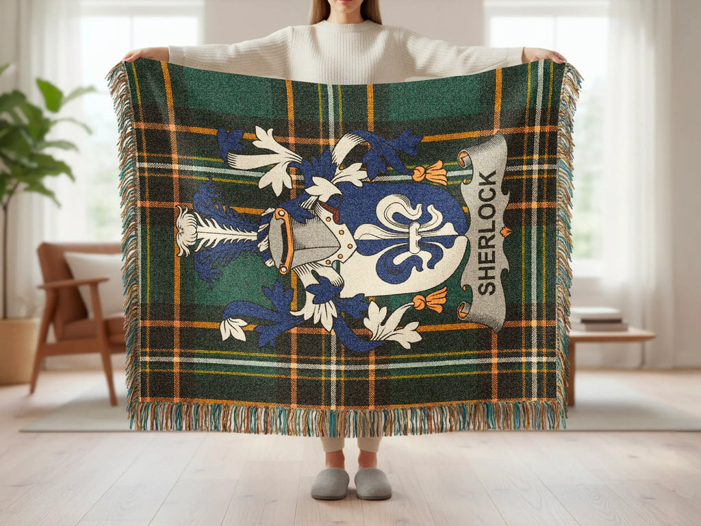Sherlock family crest on green and blue tartan throw blanket.