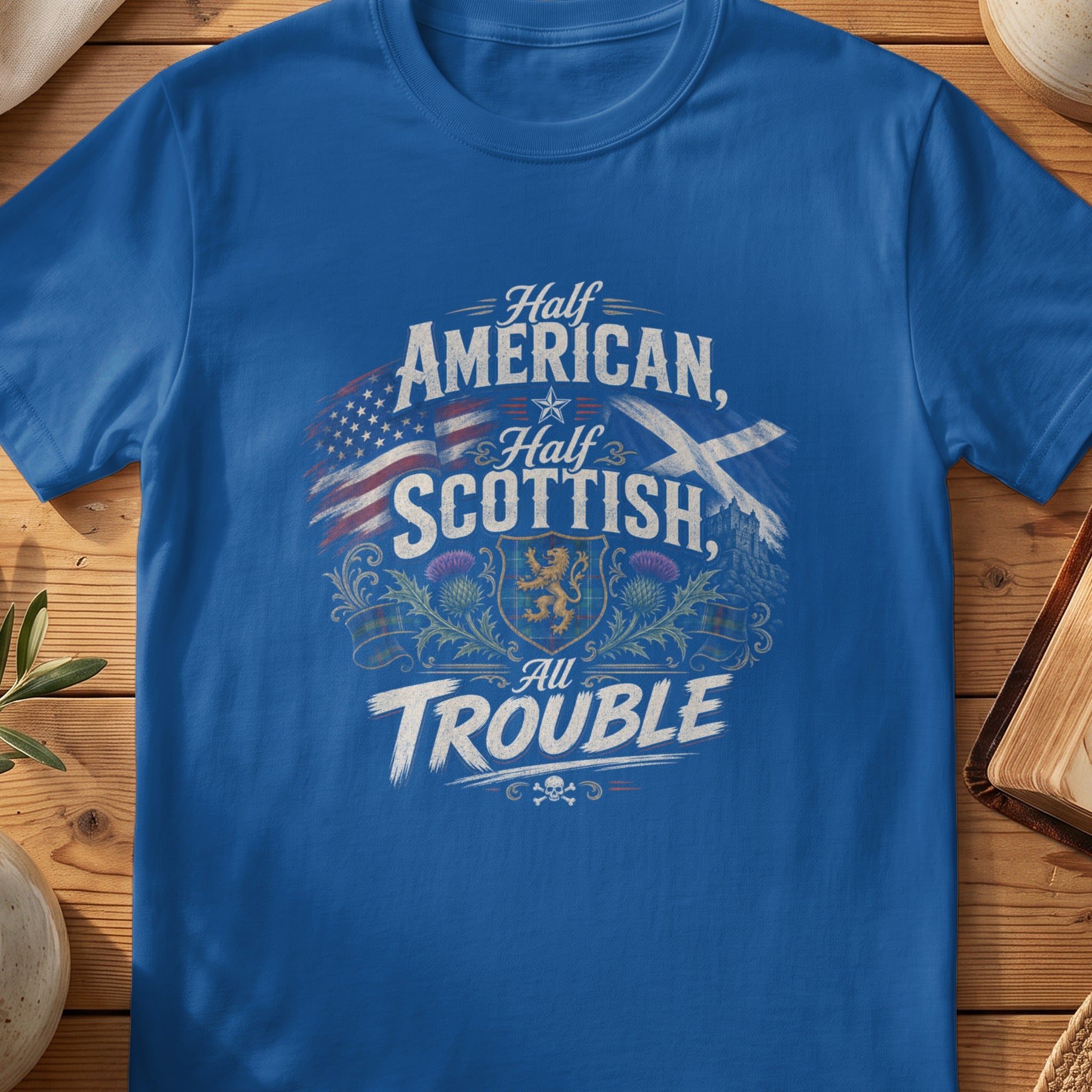Blue t-shirt with text "Half American, Half Scottish, All Trouble" and patriotic/Scottish symbols.