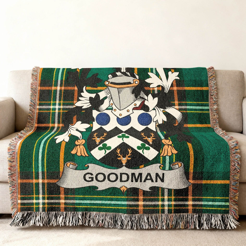 Green plaid throw blanket with Goodman family crest.