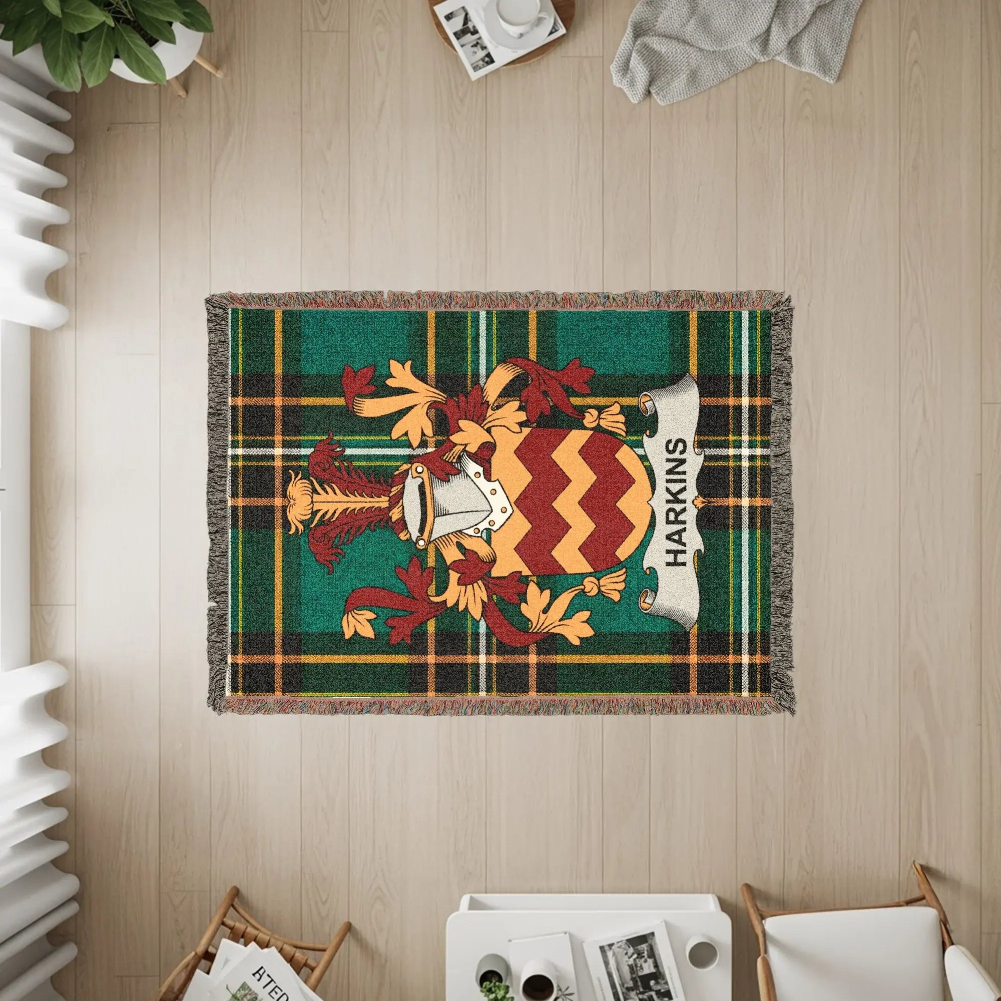 Harkins clan crest on a green plaid woven throw blanket.