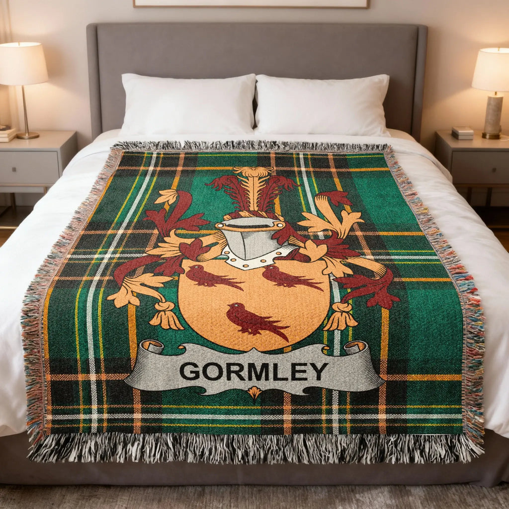 Green tartan blanket with GORMLEY coat of arms centered.