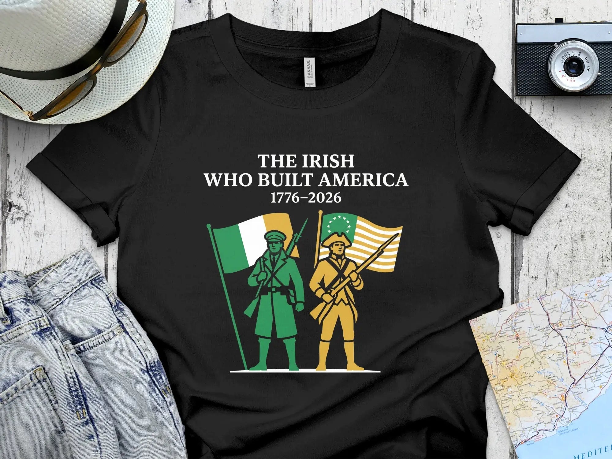 Black t-shirt with "The Irish Who Built America 1776-2026" and two figures.