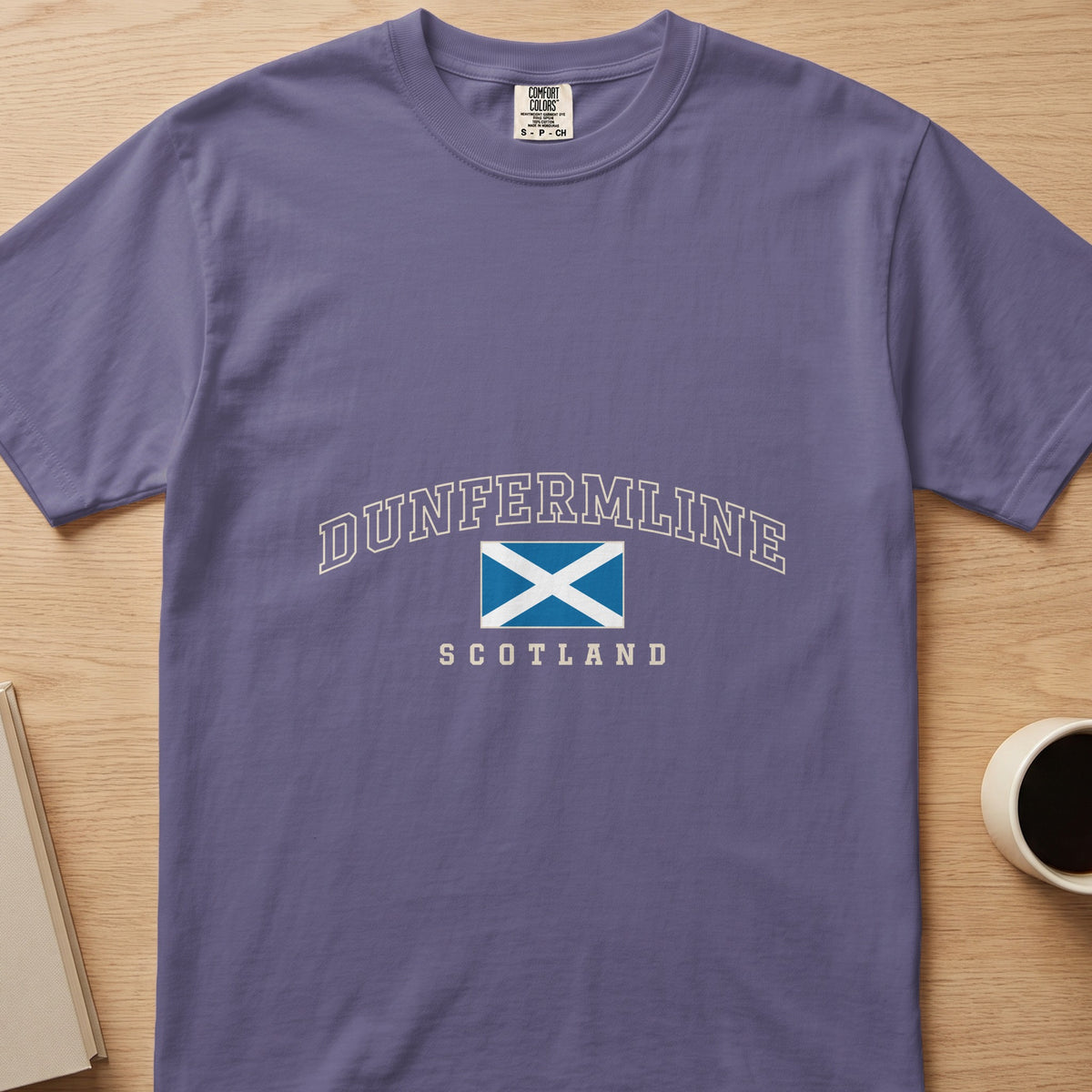 Grape purple Dunfermline Scotland Comfort Colors T-shirt laid flat with the Saltire and cream lettering