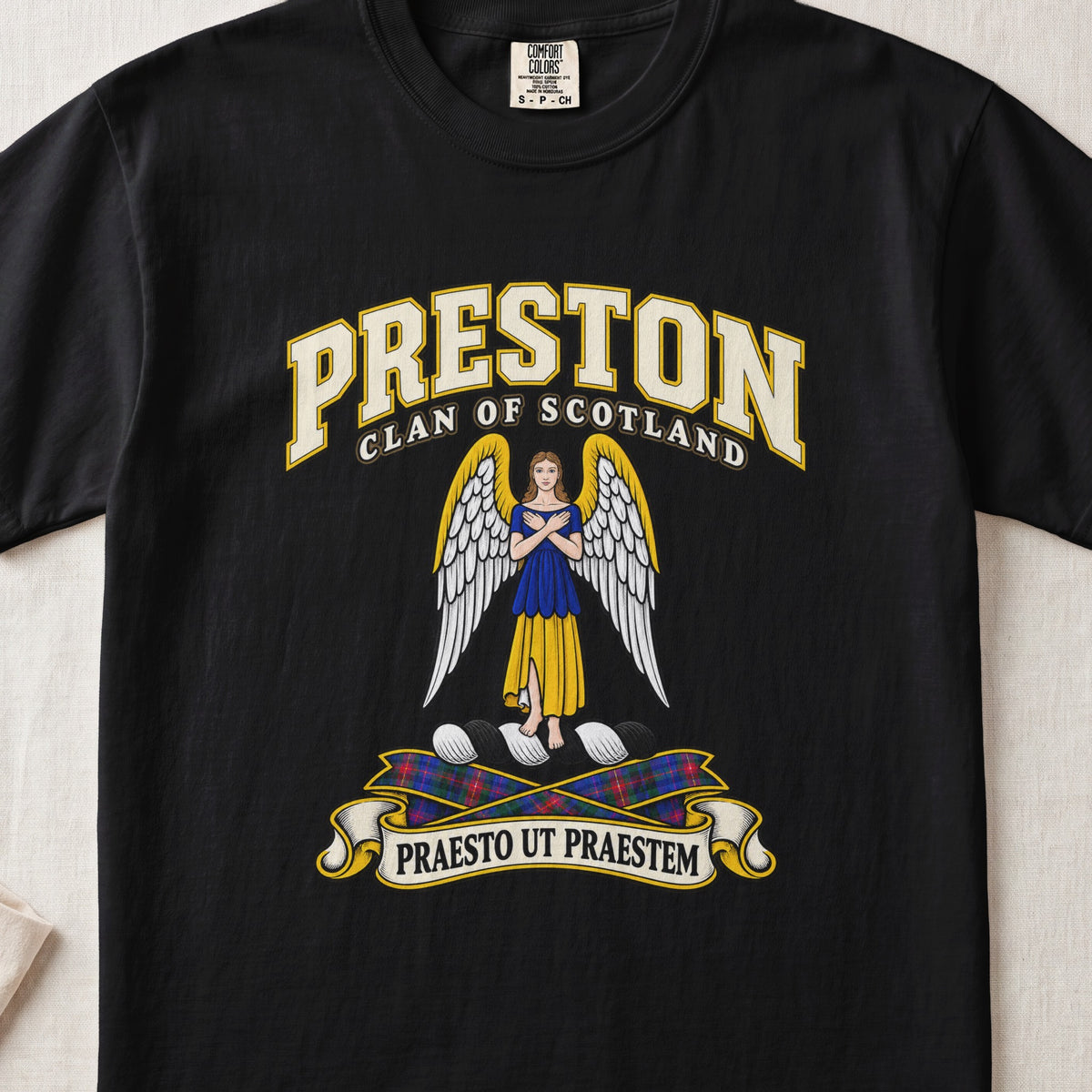 Preston Scottish clan T-shirt in Black, front view with a winged figure in blue and gold clothing and motto banner.