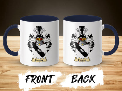 White mug with navy handle and interior, featuring the Binning coat of arms on front and back.