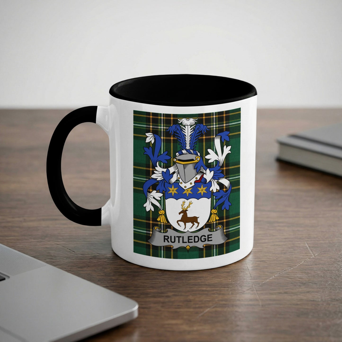 White mug with black handle and interior featuring a Rutledge family crest.