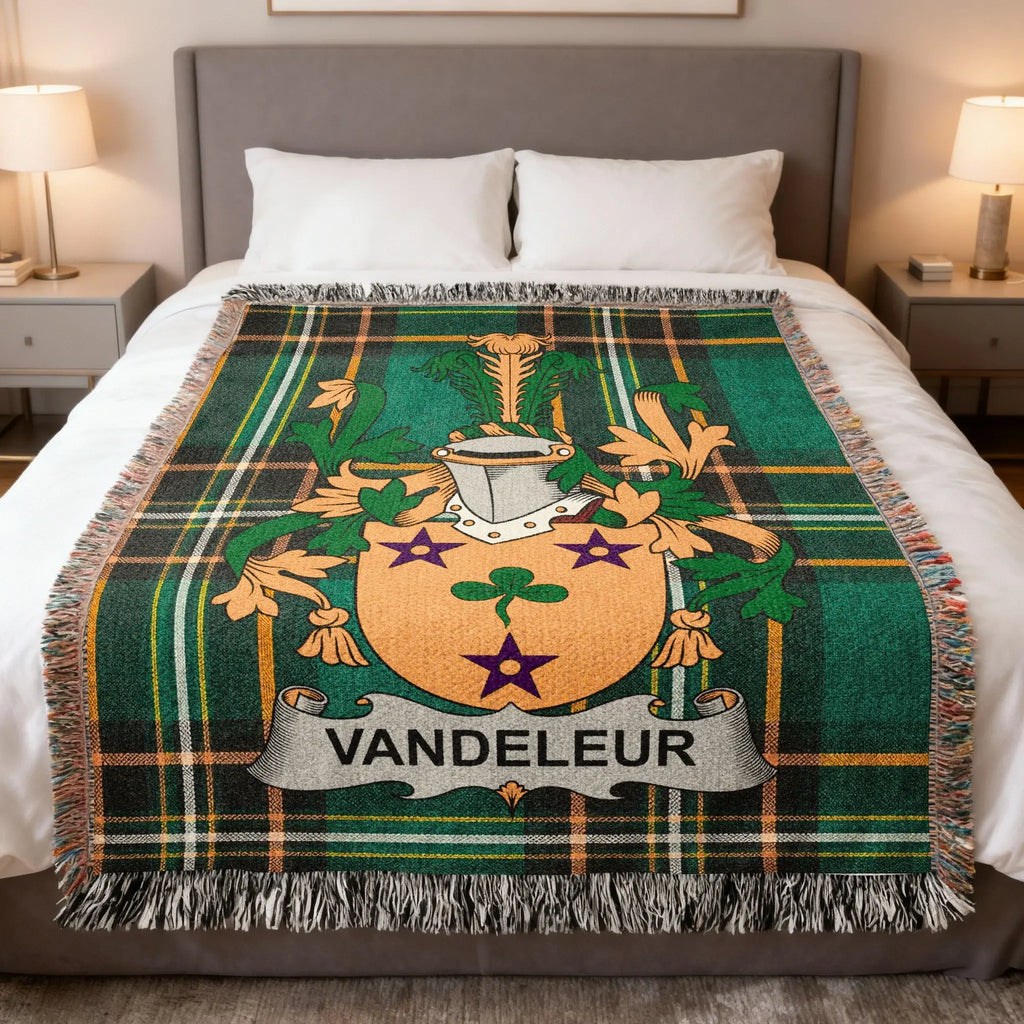 Green plaid throw blanket with the Vandeleur coat of arms.