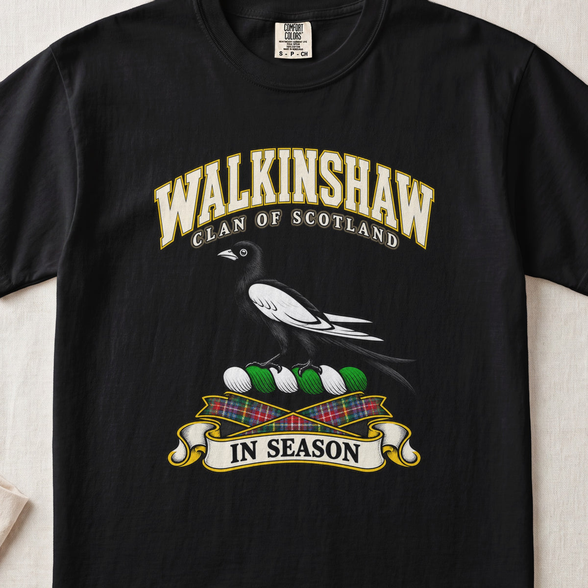 Walkinshaw Scottish clan T-shirt in Black, front view with a black and white magpie and motto design.