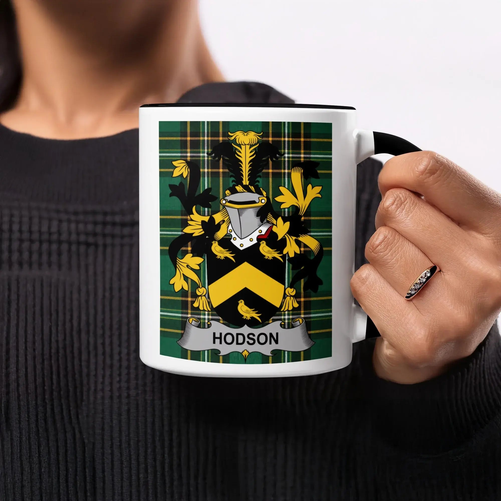 Mug with Hodson family crest on tartan background.