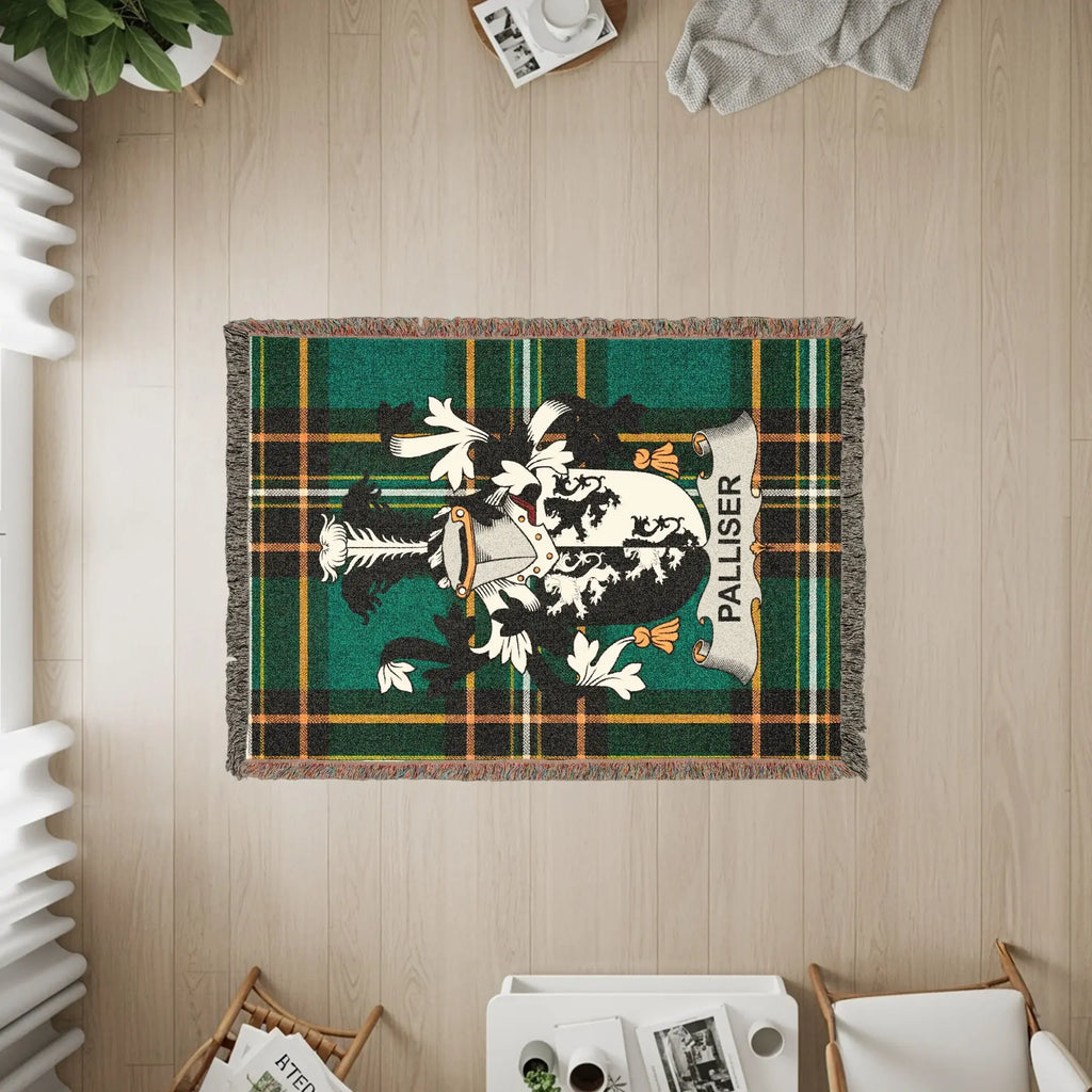 Palliser tartan crest woven blanket with fringe detail.