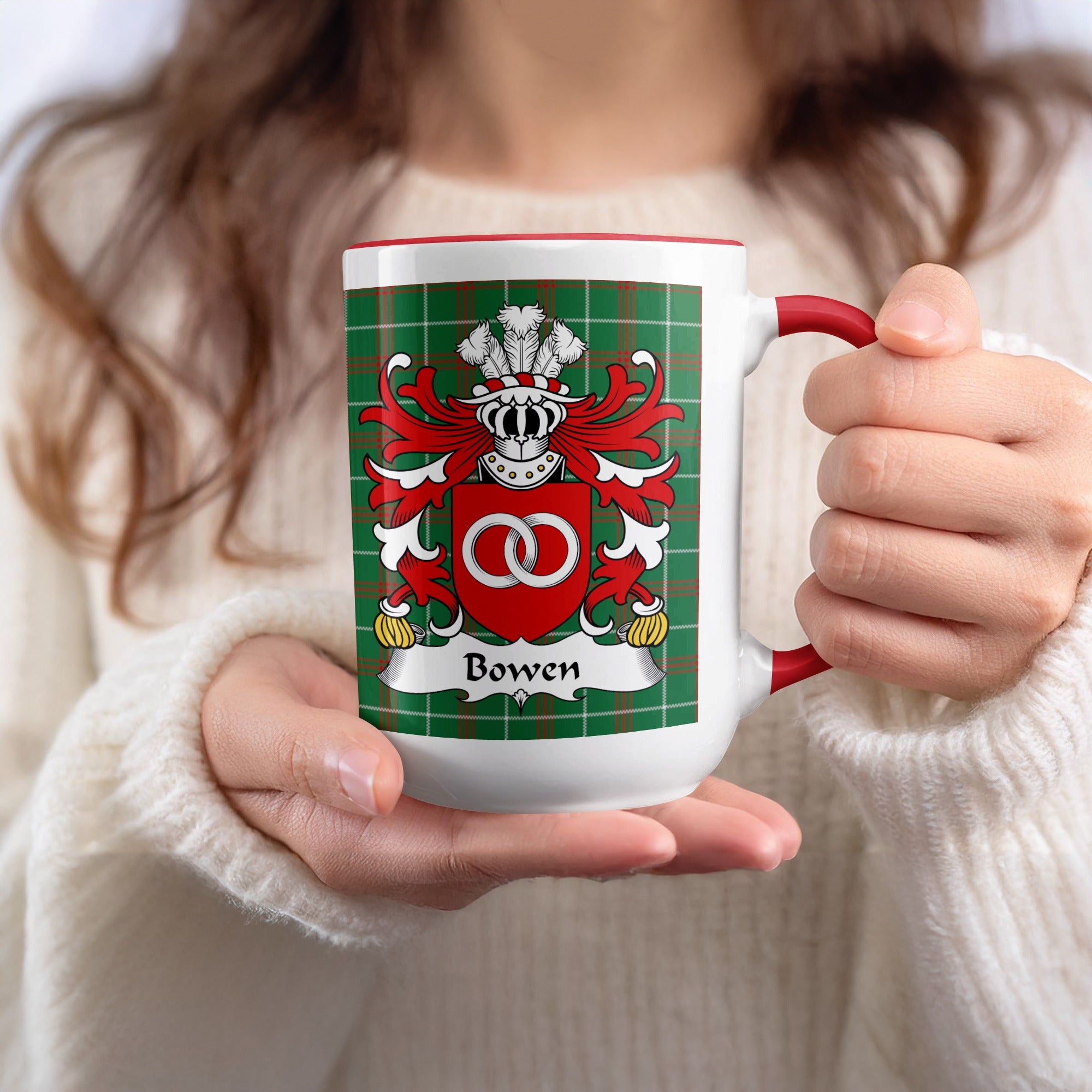 White mug with red trim, featuring the Bowen family crest on a green tartan background.
