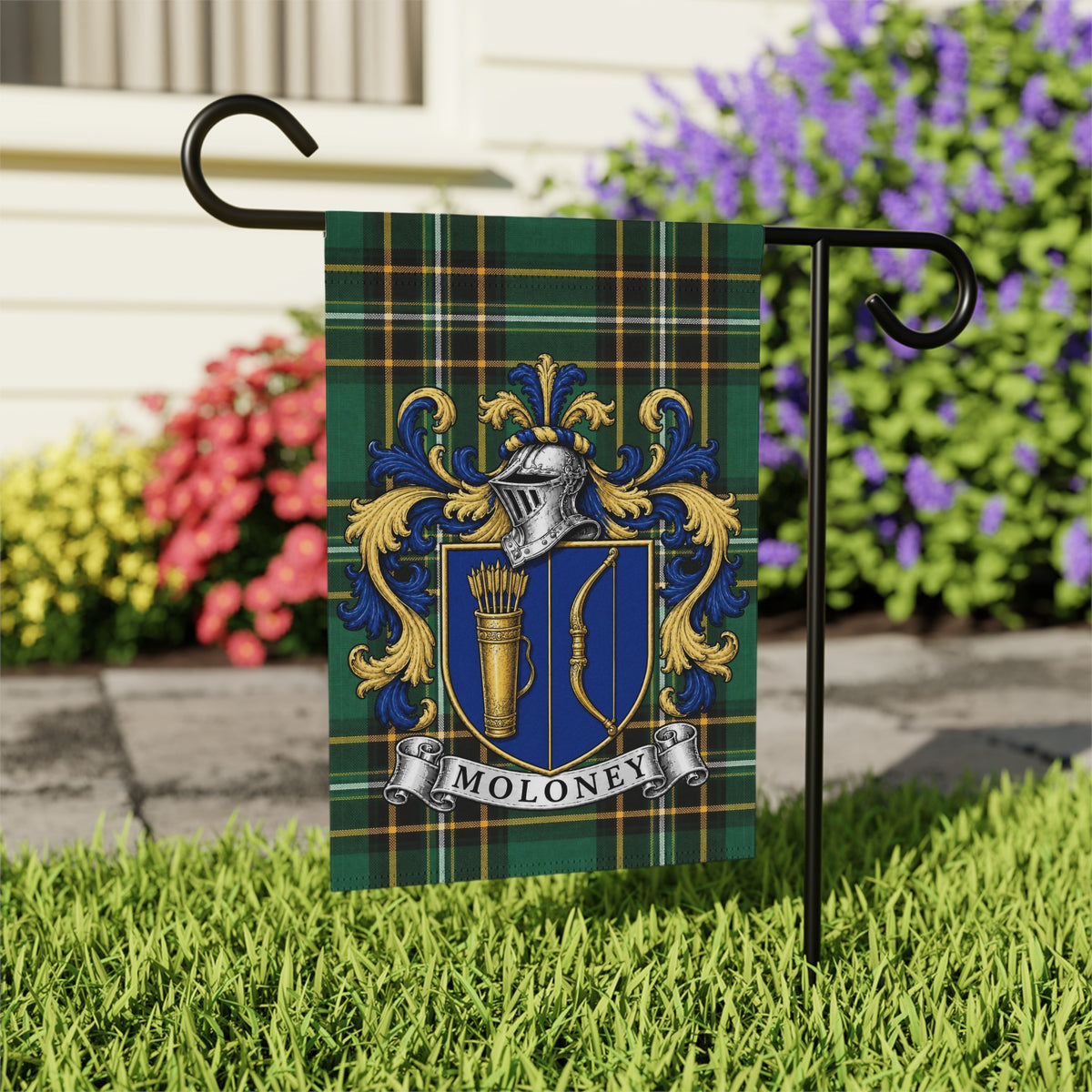 Moloney Irish family crest garden flag on Irish National Tartan, garden view