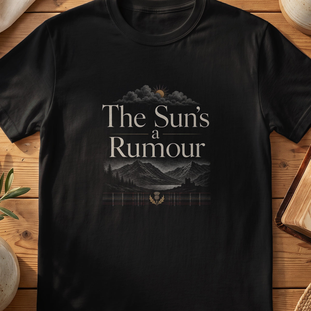 Black Gildan 64000 unisex T-shirt flatlay with The Sun's a Rumour Scottish graphic design