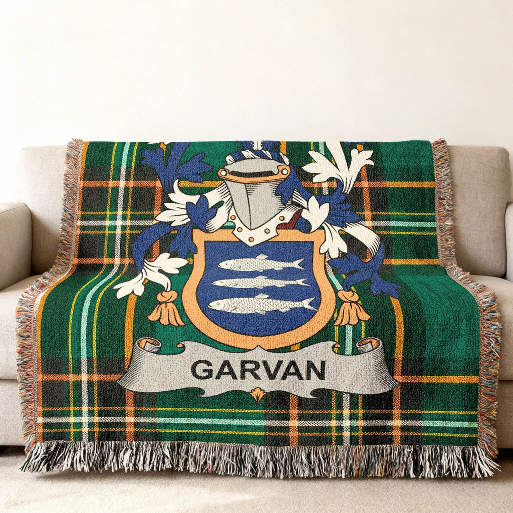 Woven tartan blanket with a coat of arms featuring the name GARVAN.