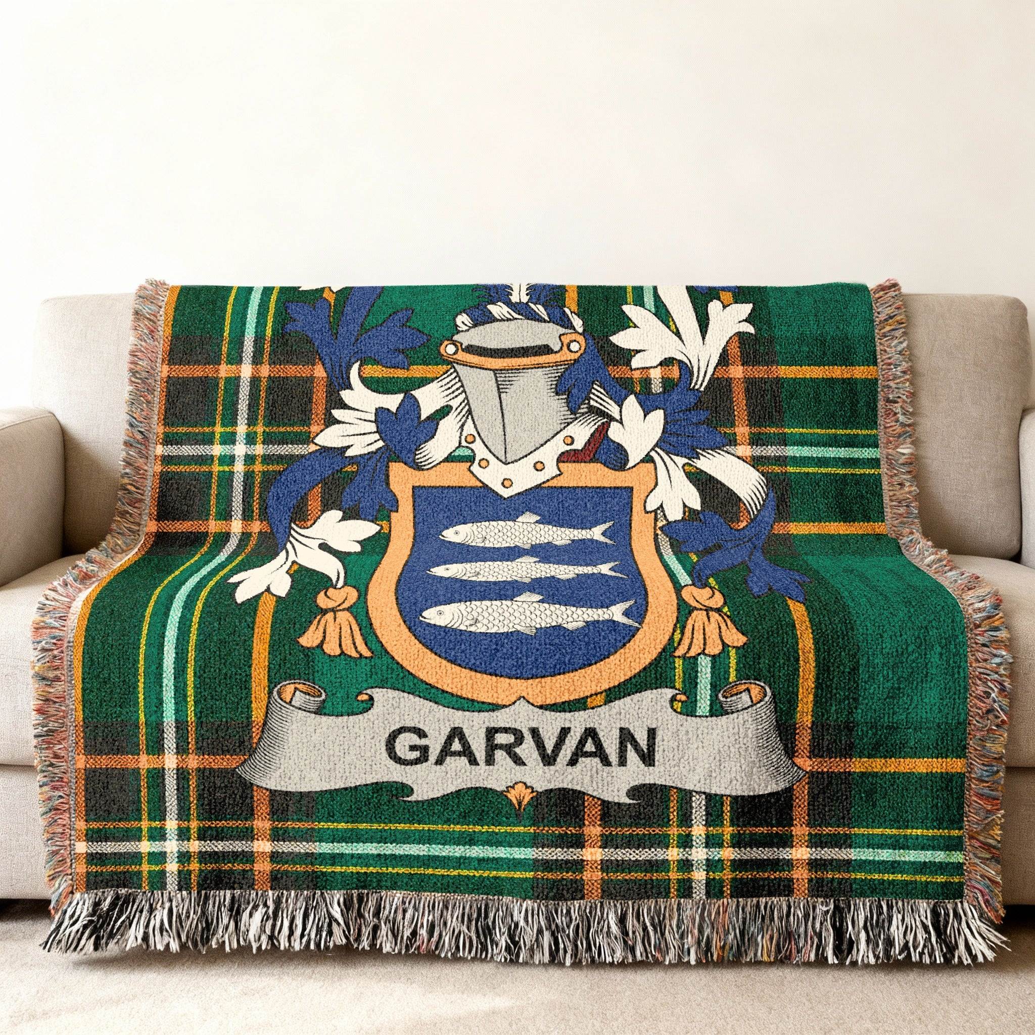 Woven tartan blanket with a coat of arms featuring the name GARVAN.
