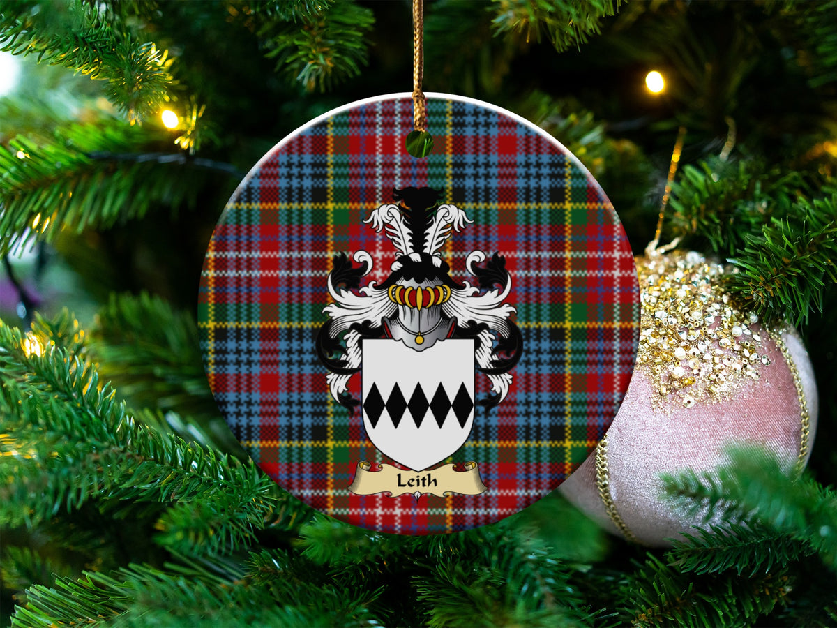 Leith Scottish clan ceramic ornament with family crest on a Caledonia tartan background, hanging on a Christmas tree