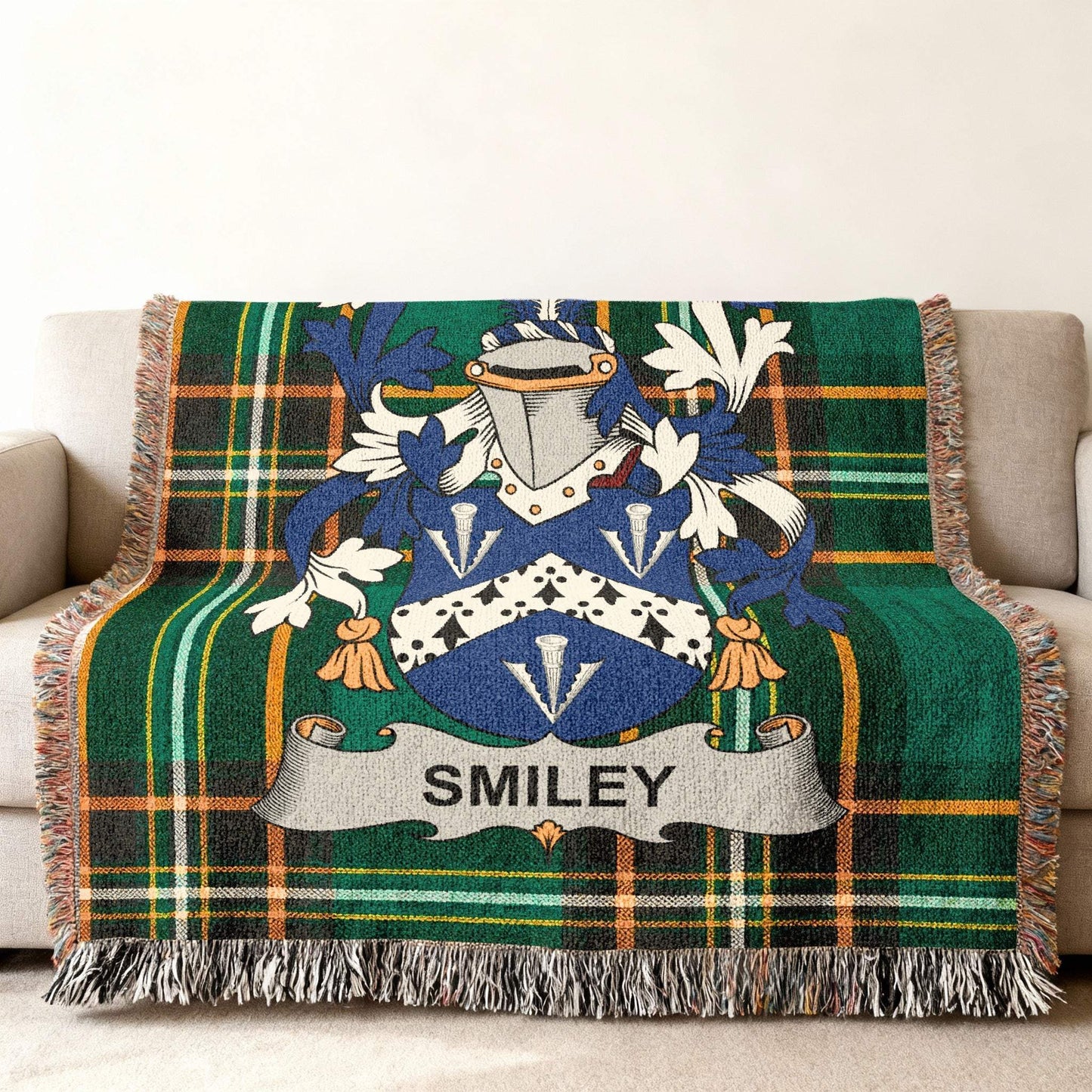 Tartan blanket with Smiley family crest in blue, white, and gold.