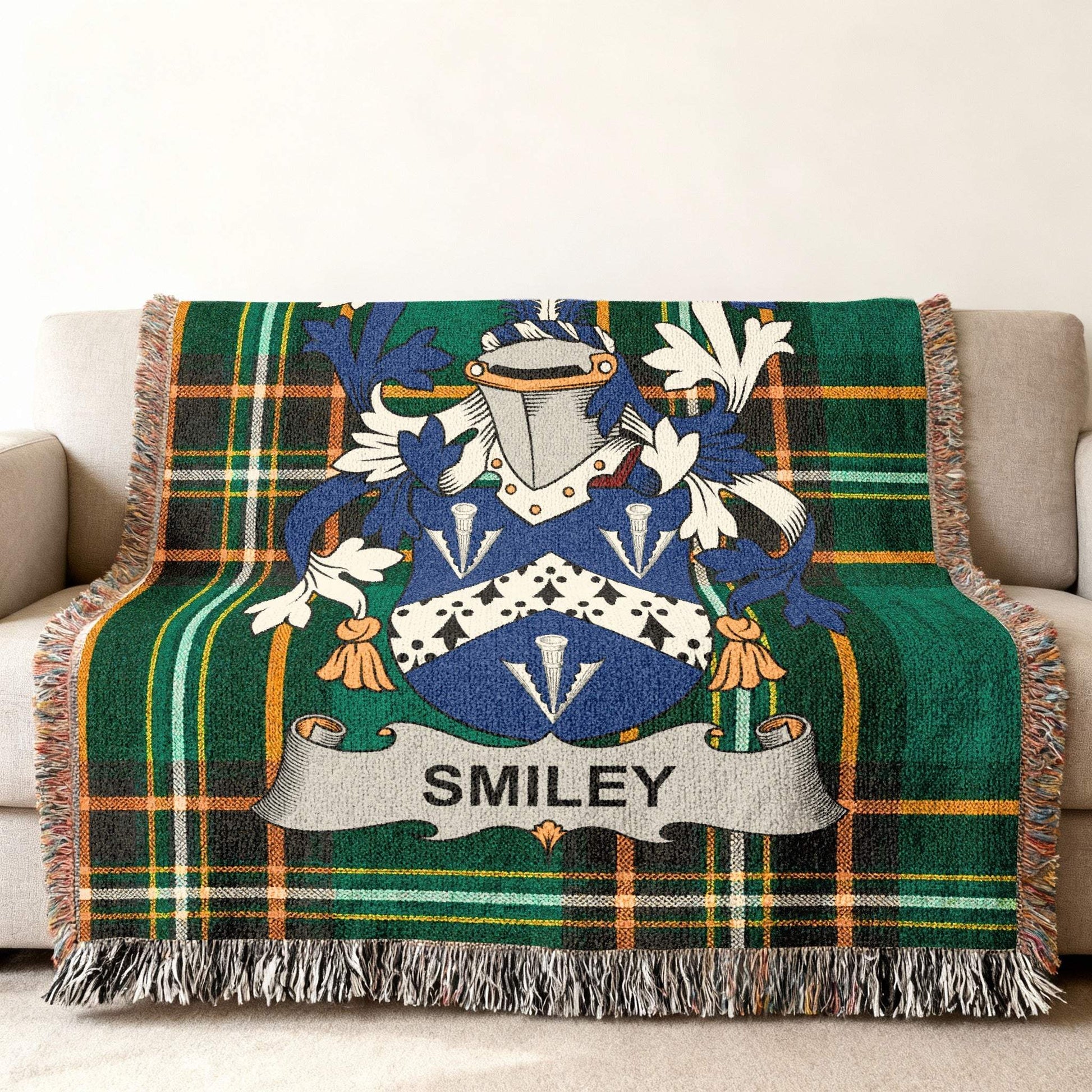 Tartan blanket with Smiley family crest in blue, white, and gold.