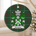 Edward Style 2 ornament hanging from a pale wooden branch; a white chevron between three white wolf heads on a green shield on Welsh national tartan.