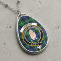 Lamont clan Scottish tartan necklace with clan crest and Ne Parcas Nec Spernas motto on tartan background
